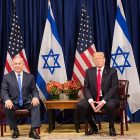 political leaders sitting and shaking hands